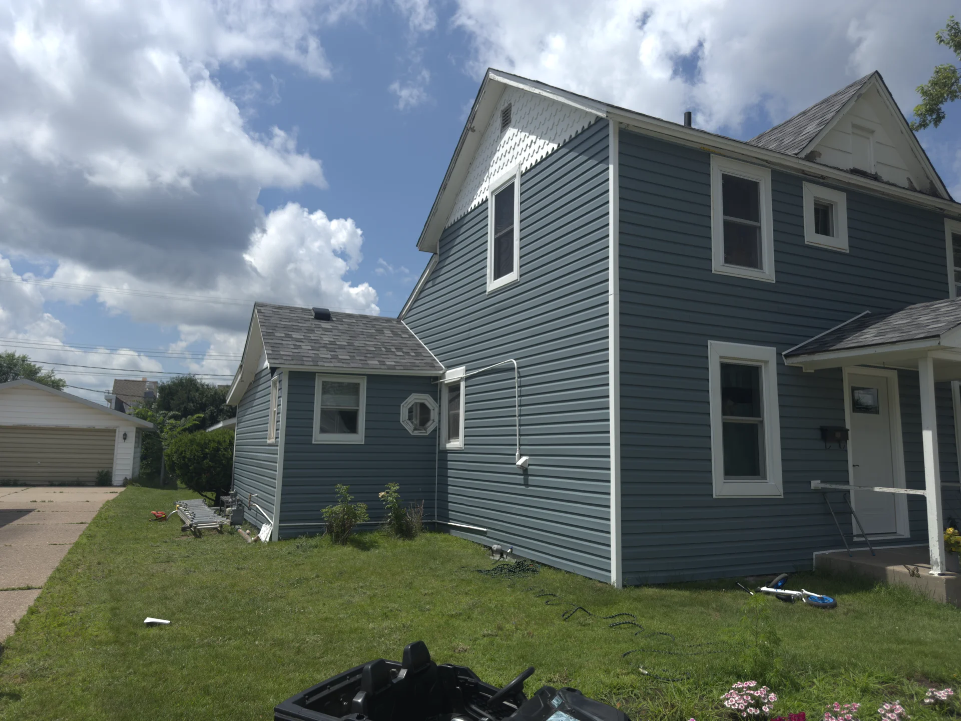 Two-Story Slate Blue Lap Siding and Scalloped Gables